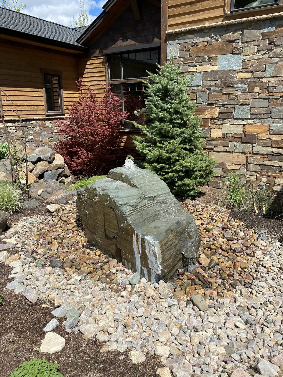 stone-water-feature-home-exterior-for-sale-clark-fork-idaho